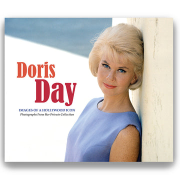 Cover of the book 'Doris Day: Images of a Hollywood Icon' featuring a photograph of Doris Day in a light blue dress, with a backdrop of a clear sky and a white structure, presumably taken during her time in Hollywood.
